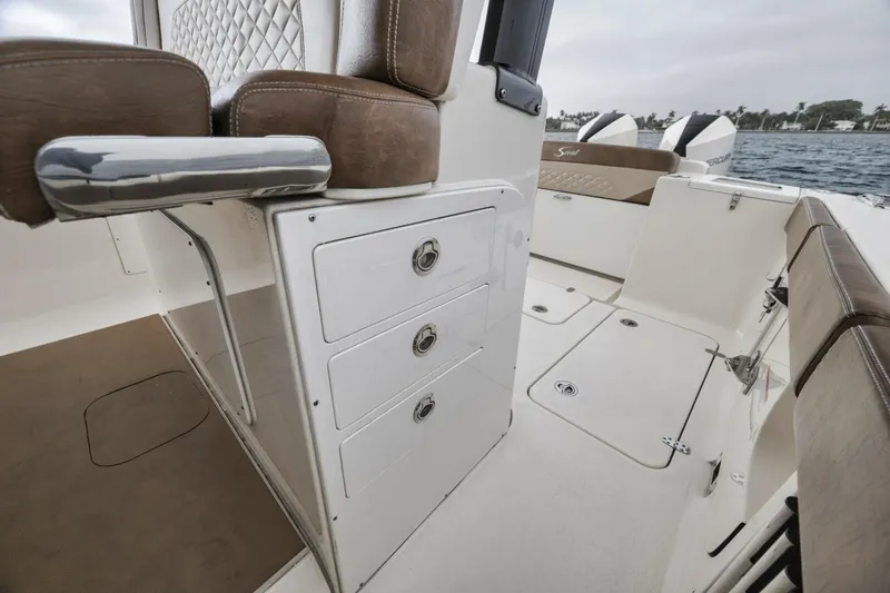 T/t Phoenix Yacht Photos Pics 2023 Scout 330 LXF boat interior with seating and storage compartments.