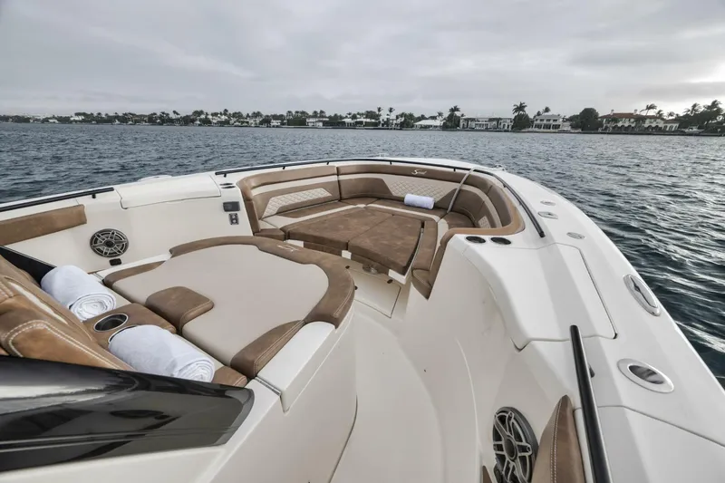 T/t Phoenix Yacht Photos Pics 2023 Scout 330 LXF boat interior with luxurious seating on open water.