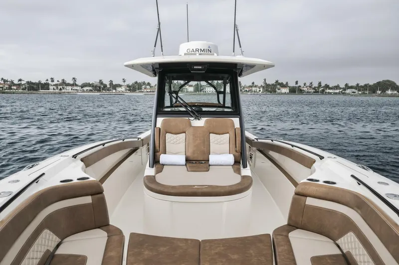 T/t Phoenix Yacht Photos Pics 2023 Scout 330 LXF boat interior with brown seating on open water.