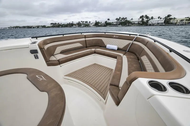 T/t Phoenix Yacht Photos Pics 2023 Scout 330 LXF boat interior with luxurious seating and ocean view.