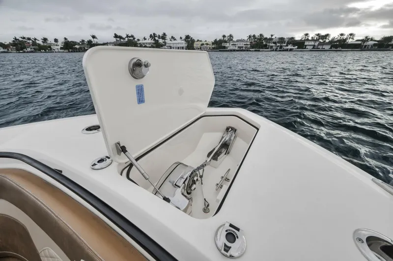 T/t Phoenix Yacht Photos Pics 2023 Scout 330 LXF boat anchor compartment open on water.