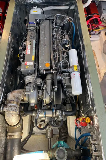 Saline Yacht Photos Pics Engine compartment of a 2005 MJM 34z Downeast boat, showcasing detailed mechanical components.