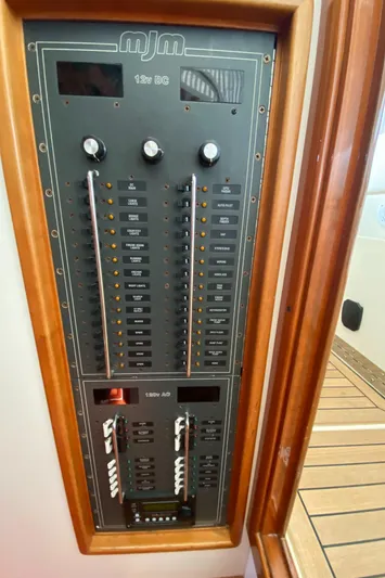 Saline Yacht Photos Pics Electrical panel of 2005 MJM 34z Downeast boat, featuring switches and controls.