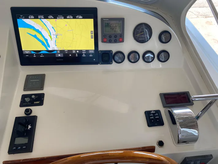 Saline Yacht Photos Pics Control panel of a 2005 MJM 34z Downeast boat with navigation display and gauges.