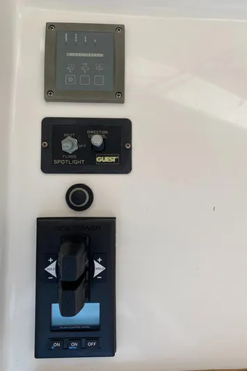 Saline Yacht Photos Pics Control panel of a 2005 MJM 34z Downeast boat with spotlight and side power controls.