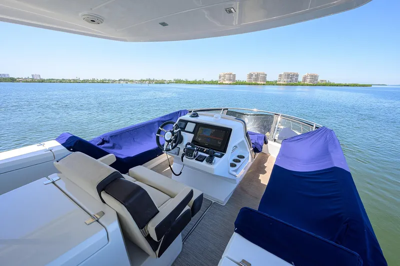 Unorthodocs Yacht Photos Pics 2018 Cruisers 60 Cantius Fly yacht helm with scenic water view.
