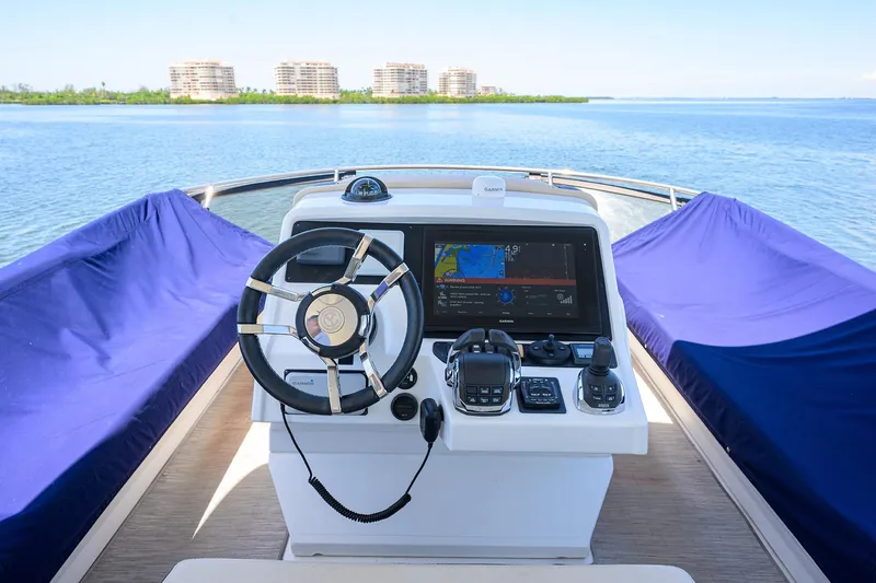 Unorthodocs Yacht Photos Pics 2018 Cruisers 60 Cantius Fly yacht helm with navigation display and steering wheel.