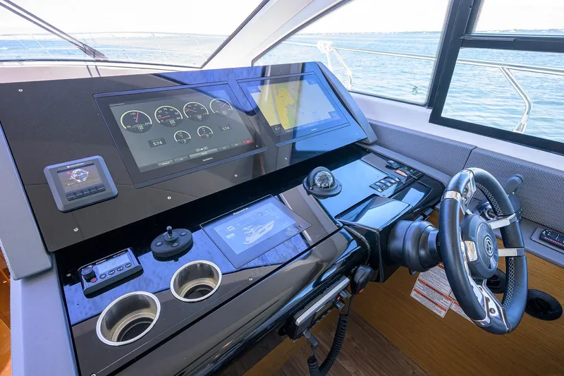 Unorthodocs Yacht Photos Pics Helm of 2018 Cruisers 60 Cantius Fly yacht with advanced navigation displays.