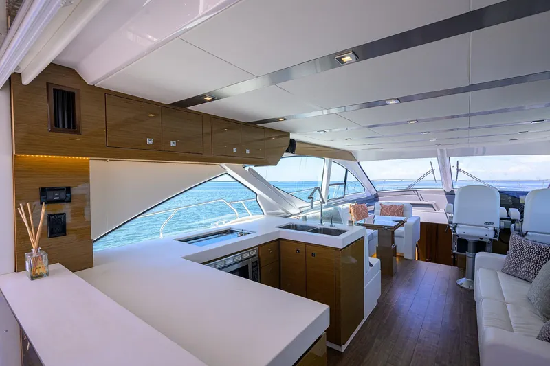Unorthodocs Yacht Photos Pics Luxurious interior of 2018 Cruisers 60 Cantius Fly yacht with modern kitchen and seating area.
