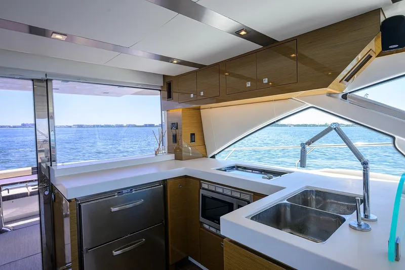 Unorthodocs Yacht Photos Pics Luxurious kitchen interior of 2018 Cruisers 60 Cantius Fly yacht with ocean view.