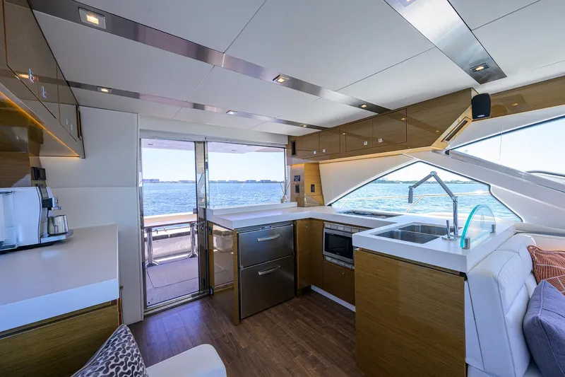 Unorthodocs Yacht Photos Pics Luxurious interior of 2018 Cruisers 60 Cantius Fly yacht with modern kitchen and ocean view.