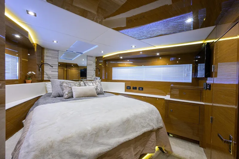 Unorthodocs Yacht Photos Pics Luxurious bedroom interior of 2018 Cruisers 60 Cantius Fly yacht with modern design and ambient lighting.