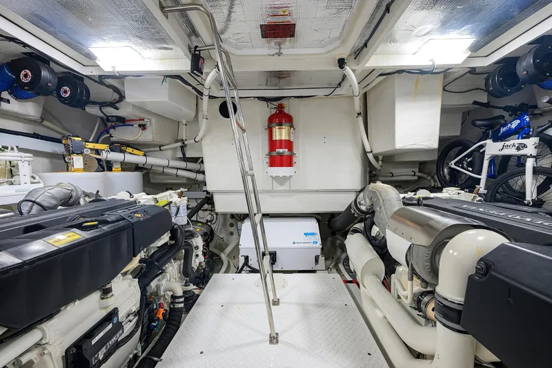 Unorthodocs Yacht Photos Pics Engine room of 2018 Cruisers 60 Cantius Fly yacht, featuring dual engines and equipment.