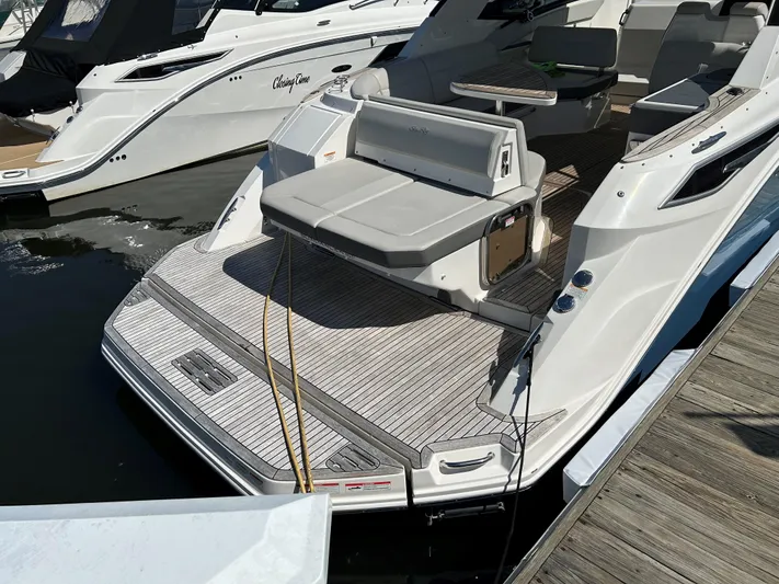 Yacht Photos Pics Sea Ray 320 DA 2021 model docked, featuring spacious rear deck and seating area.