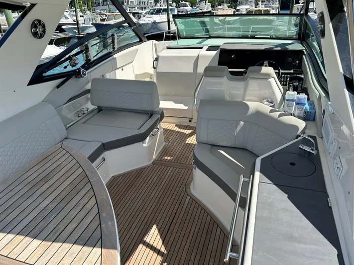  Yacht Photos Pics 2021 Sea Ray 320 DA boat interior with spacious seating and modern design.