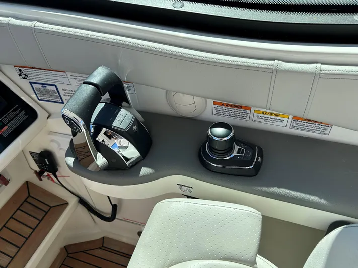  Yacht Photos Pics Control panel of a 2021 Sea Ray 320 DA boat with joystick and throttle.