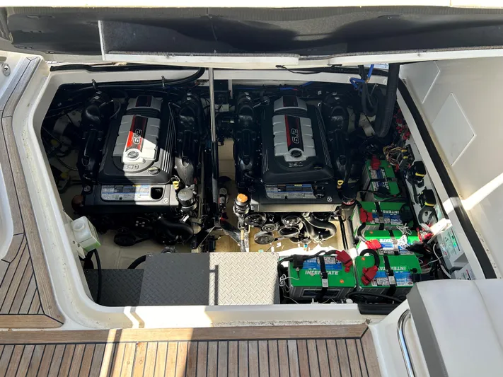  Yacht Photos Pics Engine compartment of a 2021 Sea Ray 320 DA boat with twin engines and batteries.
