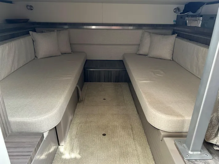  Yacht Photos Pics Interior cabin of 2021 Sea Ray 320 DA with beige seating and cushions.