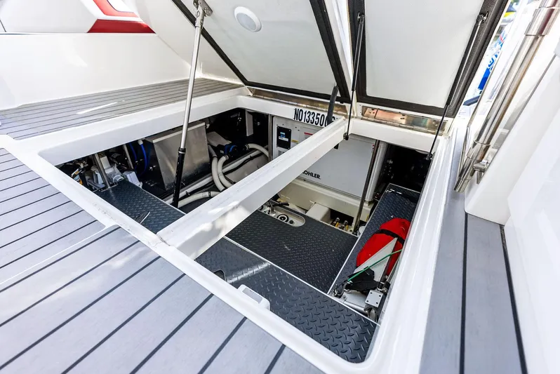 Logan's Run Yacht Photos Pics Engine compartment of 2023 Formula 430 Super Sport Crossover boat, showcasing interior components.