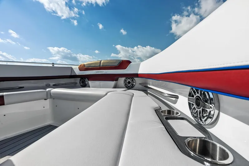 Logan's Run Yacht Photos Pics 2023 Formula 430 Super Sport Crossover interior with luxurious seating and cup holders.