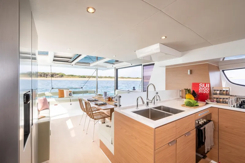 Azurea Yacht Photos Pics Modern kitchen and dining area on 2026 Bali 4.6 yacht, featuring sleek design and ocean view.