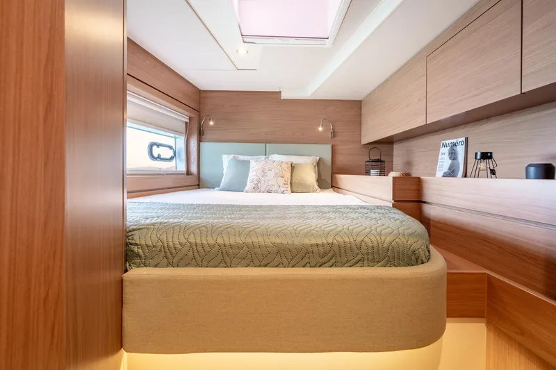 Azurea Yacht Photos Pics Luxurious cabin interior of 2026 Bali 4.6 yacht with modern wood finish and cozy bedding.
