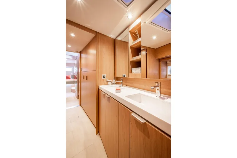 Azurea Yacht Photos Pics Modern bathroom interior on Bali 4.6 yacht, 2026 model, featuring sleek wood cabinetry and elegant fixtures.