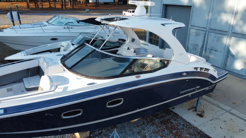  Yacht Photos Pics 2016 Chaparral 337SSX boat with sleek design, docked outdoors.