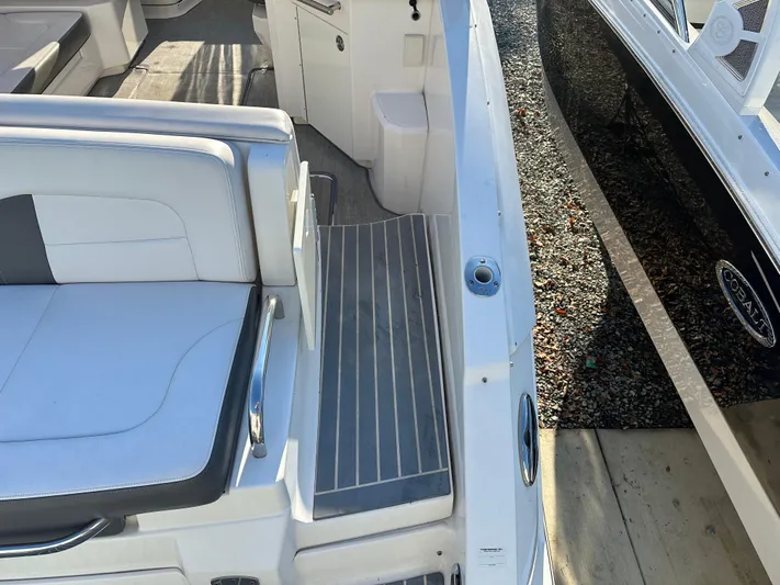  Yacht Photos Pics 2016 Chaparral 337SSX boat interior with white seating and gray flooring.