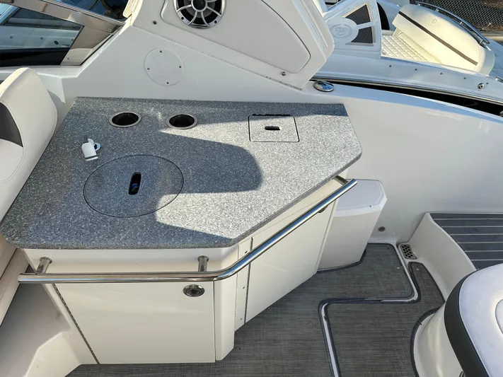  Yacht Photos Pics 2016 Chaparral 337SSX boat interior with a sleek countertop and built-in speaker.