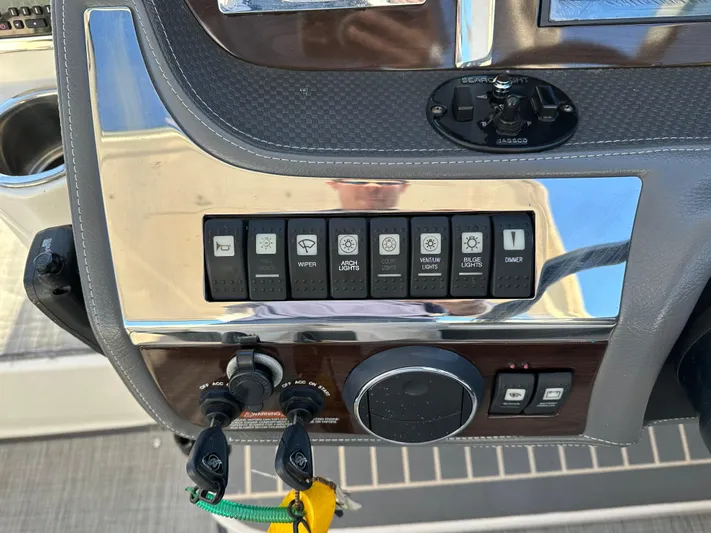  Yacht Photos Pics Control panel of a 2016 Chaparral 337SSX boat with various switches and dials.