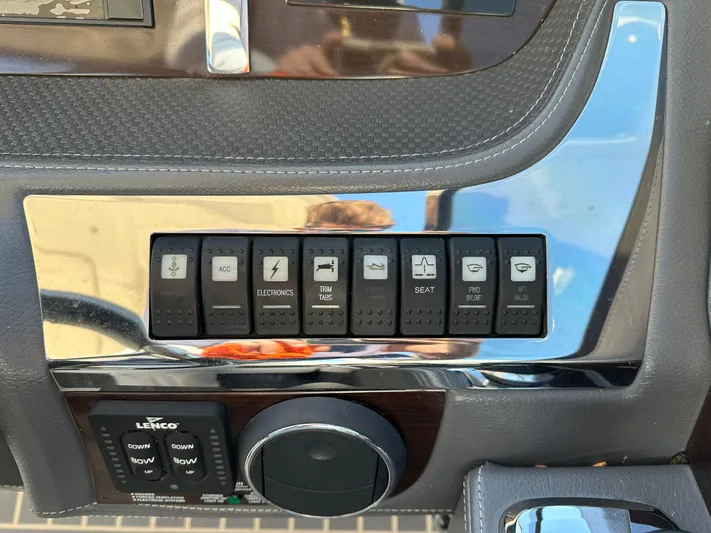  Yacht Photos Pics Control panel of a 2016 Chaparral 337SSX boat with various switches and buttons.