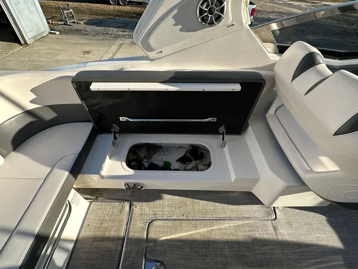 Yacht Photos Pics 2016 Chaparral 337SSX boat interior with open storage compartment.