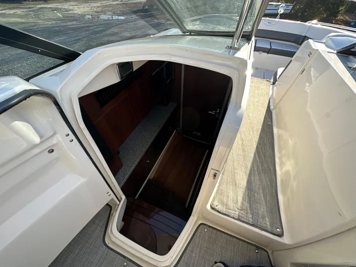  Yacht Photos Pics 2016 Chaparral 337SSX boat interior cabin entrance with wooden flooring.