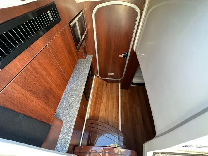  Yacht Photos Pics Interior of 2016 Chaparral 337SSX boat with wood finish and modern design.