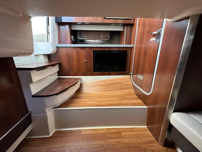  Yacht Photos Pics Interior of 2016 Chaparral 337SSX boat with wood finish and modern design.