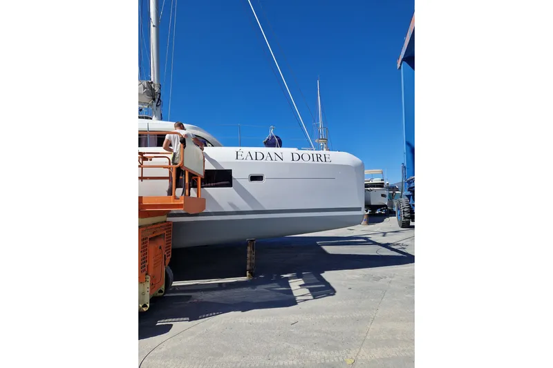 Eadan Doire Yacht Photos Pics 2017 Lagoon 42 catamaran "Éadan Doire" on dry dock under clear blue sky.