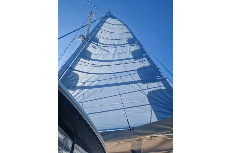 Eadan Doire Yacht Photos Pics Sail of a 2017 Lagoon 42 catamaran against a clear blue sky.