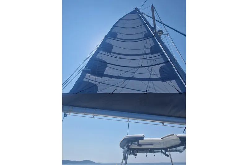 Eadan Doire Yacht Photos Pics Sail of a 2017 Lagoon 42 catamaran against a clear blue sky.