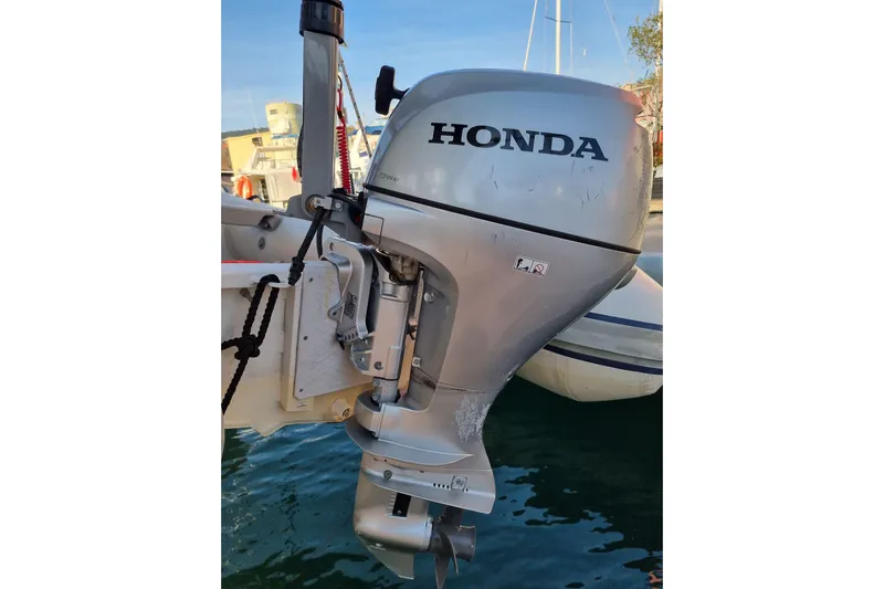 Eadan Doire Yacht Photos Pics Honda outboard motor on a 2017 Lagoon 42 catamaran, docked at marina.