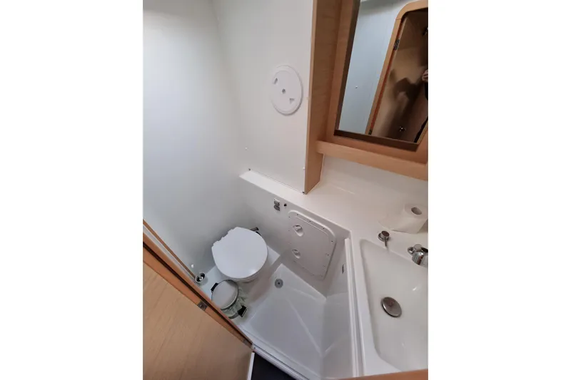 Eadan Doire Yacht Photos Pics Bathroom interior of 2017 Lagoon 42 catamaran with toilet, sink, and mirror.