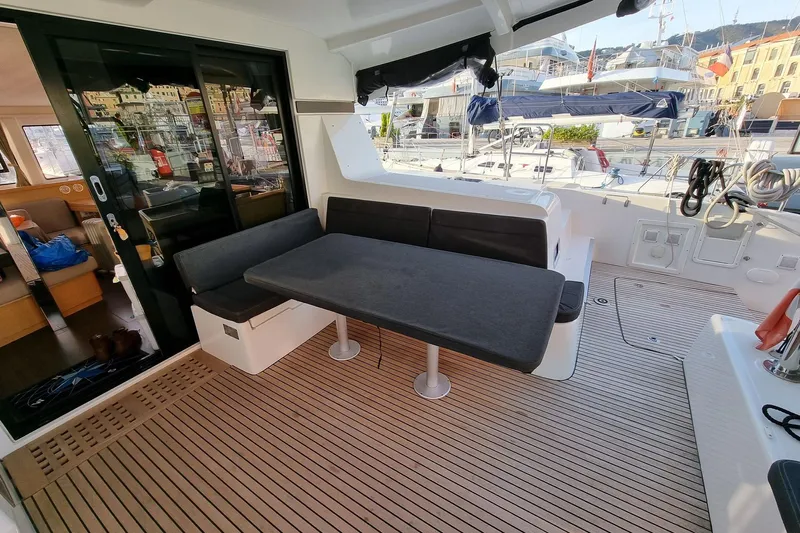 Eadan Doire Yacht Photos Pics 2017 Lagoon 42 yacht cockpit with seating, table, and marina view.