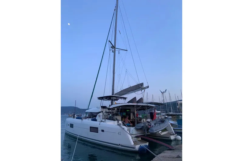 Eadan Doire Yacht Photos Pics 2017 Lagoon 42 catamaran docked at marina during twilight.