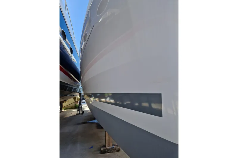 Eadan Doire Yacht Photos Pics Side view of a 2017 Lagoon 42 catamaran hull in a boatyard.