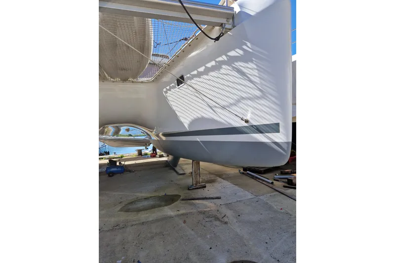 Eadan Doire Yacht Photos Pics 2017 Lagoon 42 catamaran under maintenance, showcasing sleek hull design.