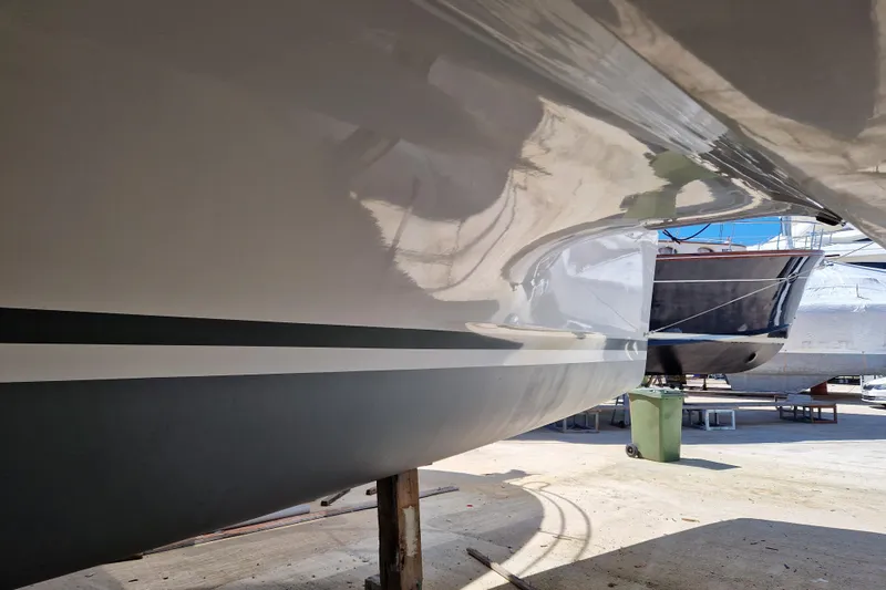 Eadan Doire Yacht Photos Pics 2017 Lagoon 42 catamaran hull in dry dock, showcasing sleek design and smooth finish.