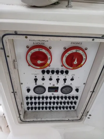 Gracie Yacht Photos Pics Control panel of a 2009 Pursuit 310 OS boat with switches and gauges.