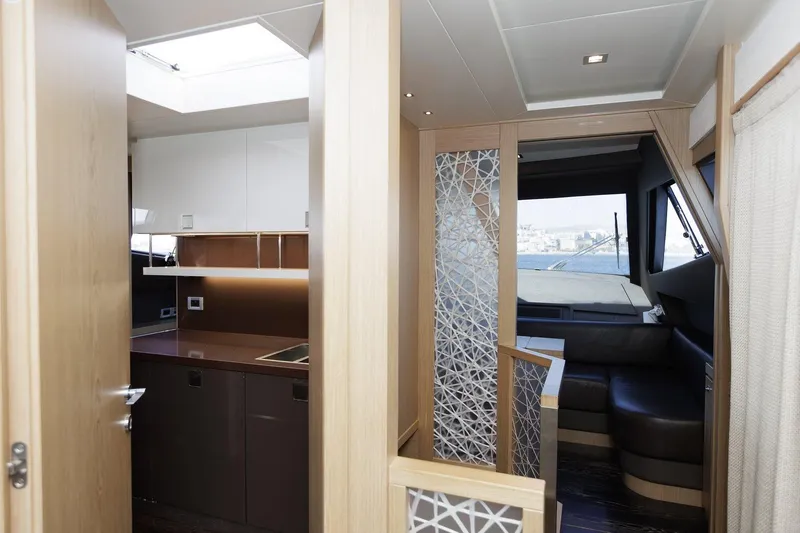 M/y Em-es II Yacht Photos Pics Luxurious interior of 2013 Ferretti Yachts 750 HT with modern kitchen and seating area.