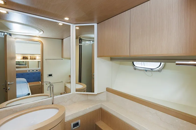 M/y Em-es II Yacht Photos Pics Luxurious bathroom interior of 2013 Ferretti Yachts 750 HT with modern fixtures and wood accents.