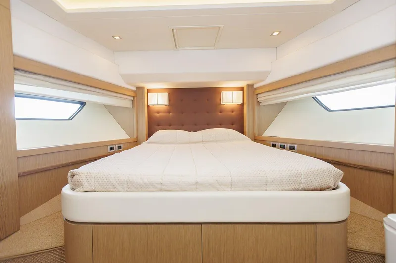 M/y Em-es II Yacht Photos Pics Luxurious bedroom interior of 2013 Ferretti Yachts 750 HT with modern design and cozy lighting.